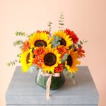 گلدان شیشه‌ای آفتابگردان و داوودی پاییزی - گلفروشی گیان